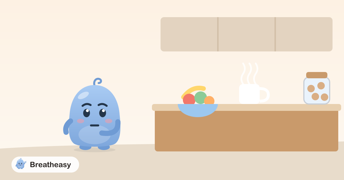 Luma standing by a kitchen counter with a bowl of fruit and a mug of tea, with a cookie jar at the far end.